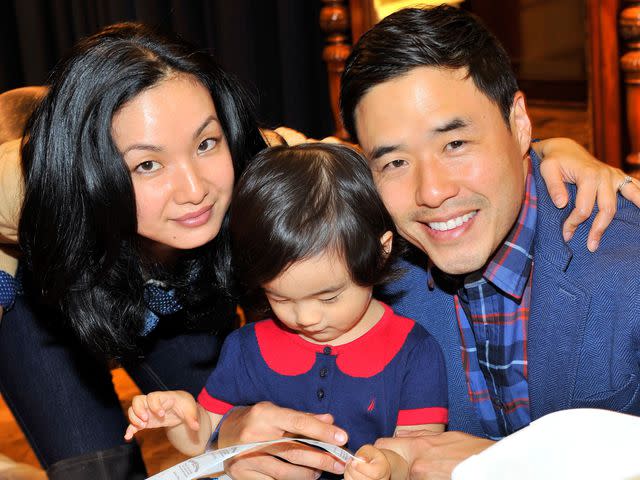 <p>Donato Sardella/Getty</p> Jae Suh Park and Randall Park with their daughter Ruby, attend as Brooks Brothers celebrates the holidays with St. Jude Children's Research Hospital on December 13, 2014.