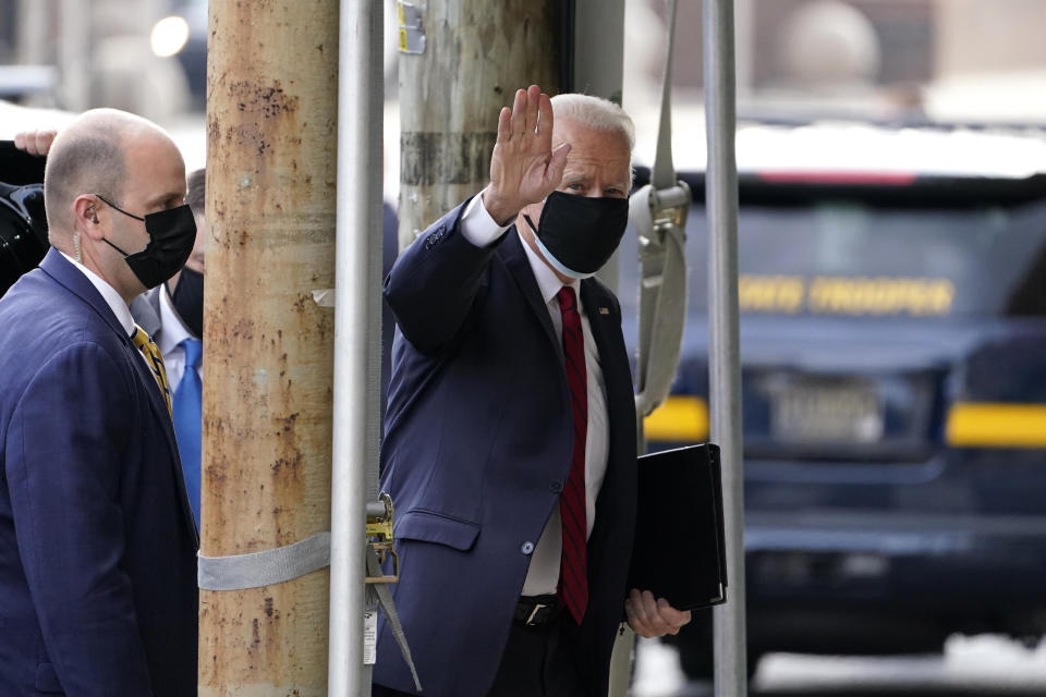 President-elect Joe Biden waves as he arrives at The Queen theater, Friday, Jan. 15, 2021, in Wilmington, Del. (AP Photo/Matt Slocum)