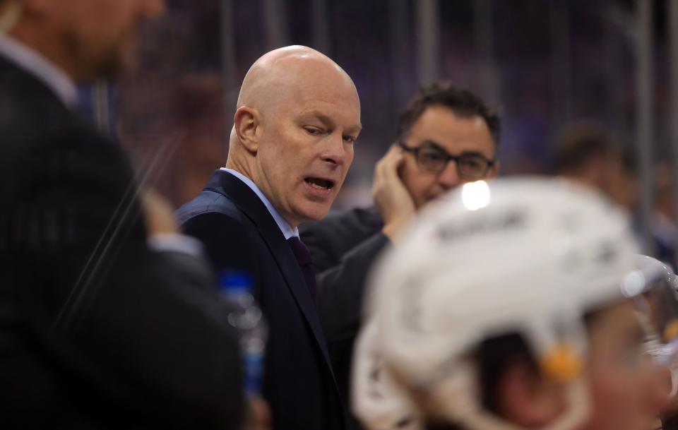 Dec 12, 2021; New York, New York, USA; Nashville Predators head coach John Hynes speaks to his players on the bench during the second period against the New York Rangers at Madison Square Garden.