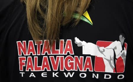 The back of Brazilian taekwondo fighter Natalia Falavigna's T-shirt is pictured as she attends a training session at Brazil's Olympic Center in Rio de Janeiro March 8, 2012. REUTERS/Sergio Moraes