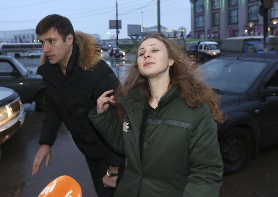 Alyokhina, member of Russian punk band Pussy Riot, speaks to the media at a train station in Nizhny Novgorod