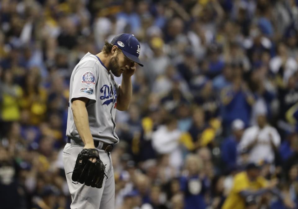 Los Angeles Dodgers starting pitcher Clayton Kershaw reacts during the fourth inning of Game 1 of the National League Championship Series baseball game against the Milwaukee Brewers Friday, Oct. 12, 2018, in Milwaukee. (AP Photo/Matt Slocum)