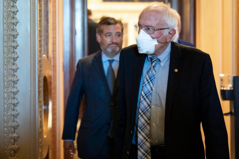 (L-R) Sen. Ted Cruz (R-TX) and Sen. Bernie Sanders (I-VT) leave the Senate Chamber after final passage of the Inflation Reduction Act at the U.S. Capitol August 7, 2022 in Washington, DC. (Getty Images)