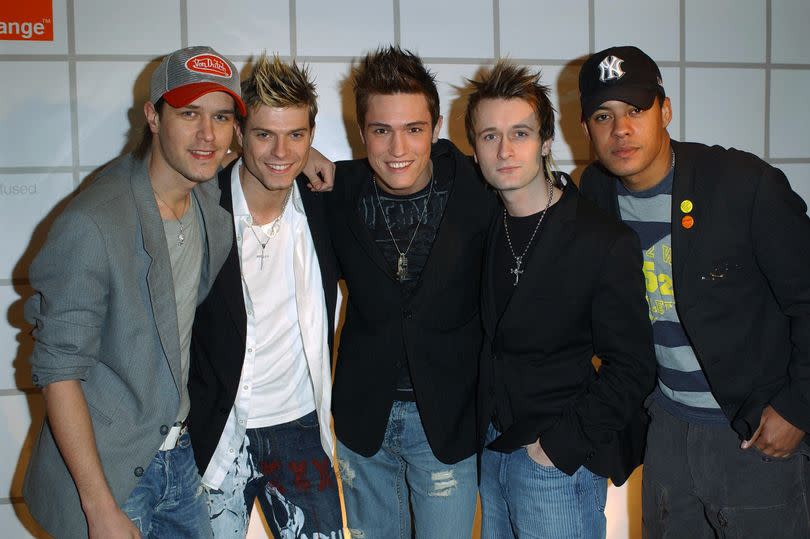 Boyband Phixx (L to R) Andrew Kinlochan, Mikey Green, Nikk Mager, Chris Park and Peter Smith arrive at the "The Orange Expressionist Exhibition" at The Vinyl Factory on January 27, 2004 in London.