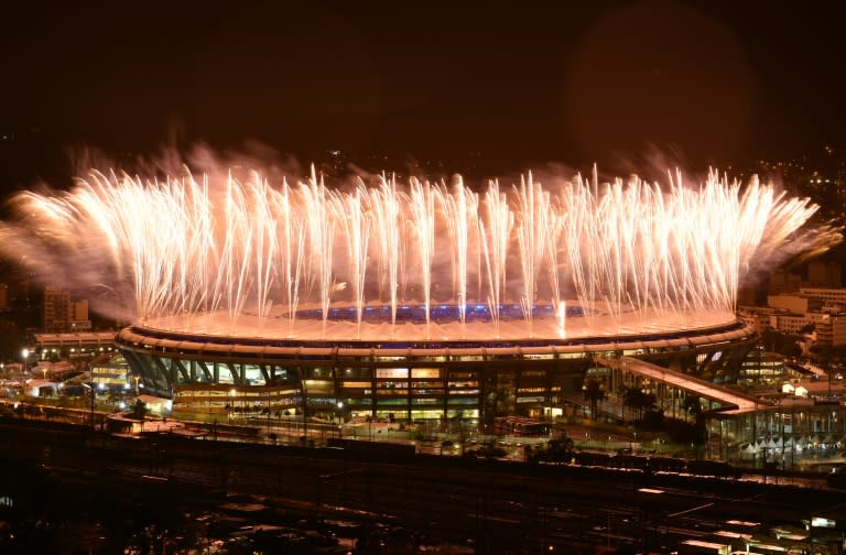 Fireworks explode at the start of the closing ceremony of the Rio 2016 Olympic Games