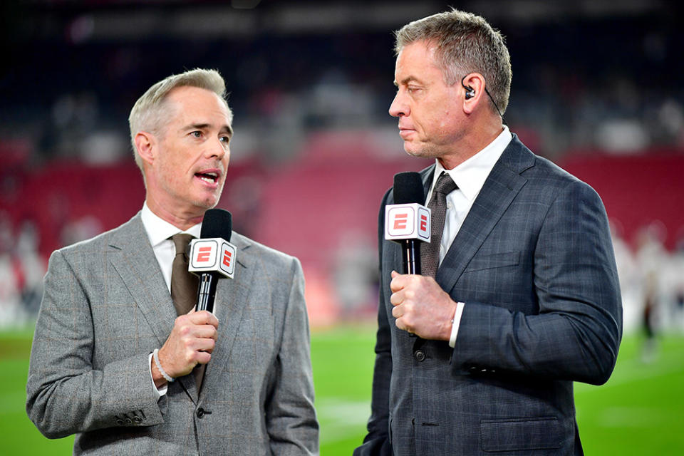 Joe Buck and Troy Aikman look on prior to a game between the Dallas Cowboys and Tampa Bay Buccaneers in the NFC Wild Card playoff game at Raymond James Stadium on January 16, 2023 in Tampa, Florida.