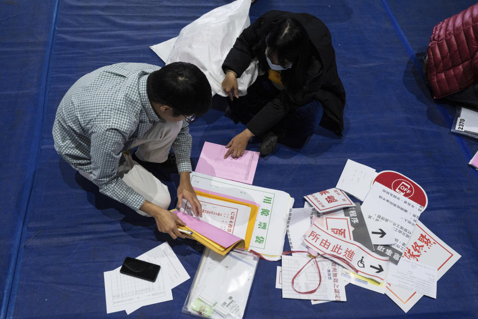 Staff prepare materials for polling booth in New Taipei, Taiwan on Friday, Jan. 12, 2024 ahead of the presidential election on Saturday. (AP Photo/Louise Delmotte)