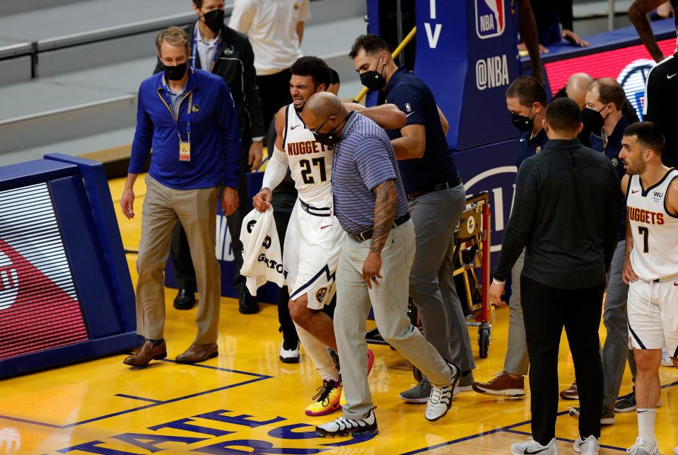 <p>Jamal Murray walked off the court following the injury</p> (Getty Images)