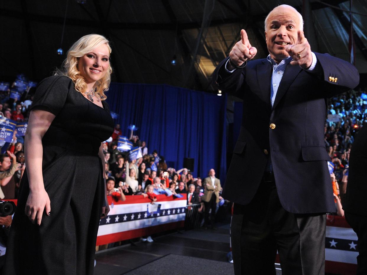 US Republican presidential candidate John McCain and his daughter Meghan McCain (L) attend a campaign rally at Otterbein College in Westerville, Ohio on October 19, 2008.