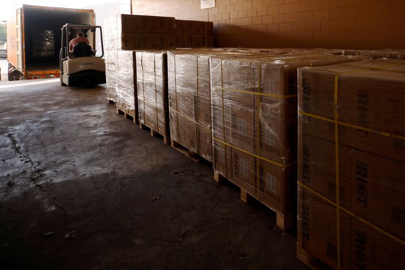 FILE PHOTO: The path of a mobile gaming controller from a Chinese factory onto the shelves of a U.S. store in Pembroke