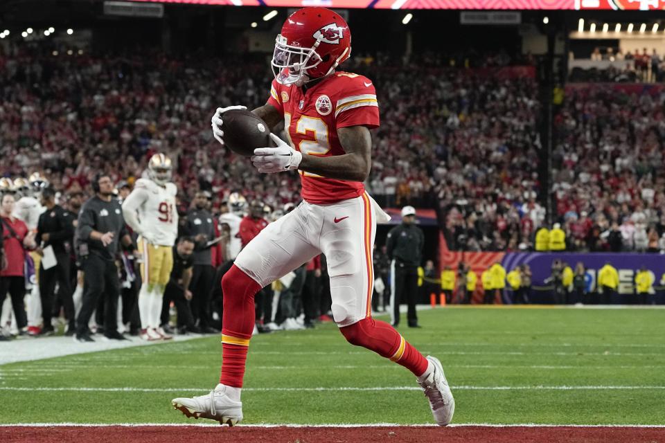Kansas City Chiefs wide receiver Mecole Hardman Jr. (12) scores a touchdown against the San Francisco 49ers in overtime during the NFL Super Bowl 58 football game Sunday, Feb. 11, 2024, in Las Vegas. The Chiefs won 25-22. (AP Photo/George Walker IV)
