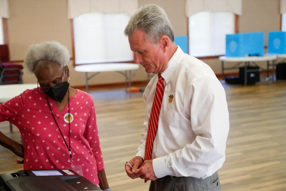 Congressman Earl "Buddy" Carter waits for the print out of his ballot to scan on Tuesday November 8, 2022 at Rothwell Street Baptist Church in Pooler, Georgia.