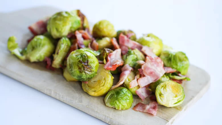 Brussels sprouts on board with bacon bits