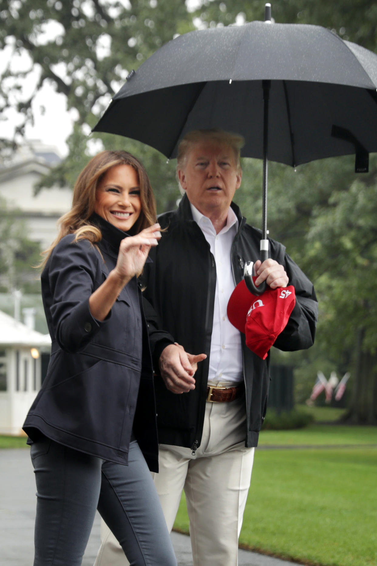 Melania and Donald Trump held hands before traveling to Florida to visit victims of Hurricane Michael. (Photo: Getty Images)