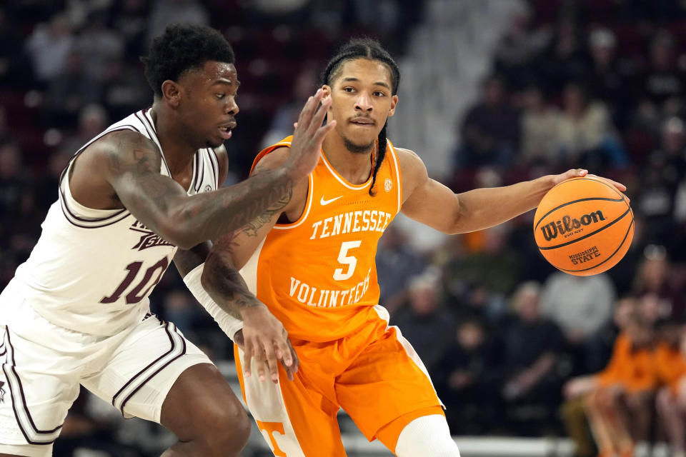 Tennessee guard Zakai Zeigler (5) attempts to dribble past Mississippi State guard Dashawn Davis (10) during the first half of an NCAA college basketball game, Wednesday, Jan. 10, 2024, in Starkville, Miss. (AP Photo/Rogelio V. Solis)