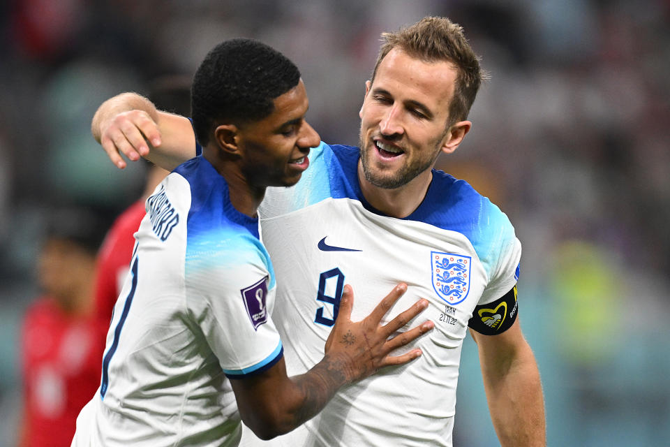 Harry Kane (right) celebrates with Marcus Rashford after the Manchester United striker scores against Iran at the 2022 FIFA World Cup.