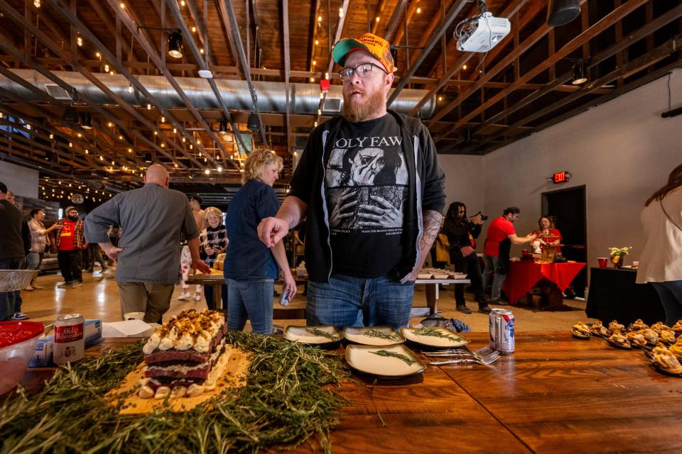 Andrew Whitmoyer describes his meat cake creation during the annual Meat Cake Invitational, Sunday, Feb. 25, 2024, at Half Liter Beer & BBQ Hall, in Indianapolis.