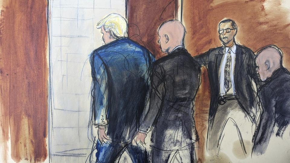 In this courtroom sketch, former President Donald Trump, left, is escorted out of the courtroom by a U.S. Marshal with co-defendant Walt Nauta, right, walking behind him as another U.S, Marshal holds the door follow their proceeding in federal court, Tuesday, June 13, 2023, in Miami. (Elizabeth Williams via AP)