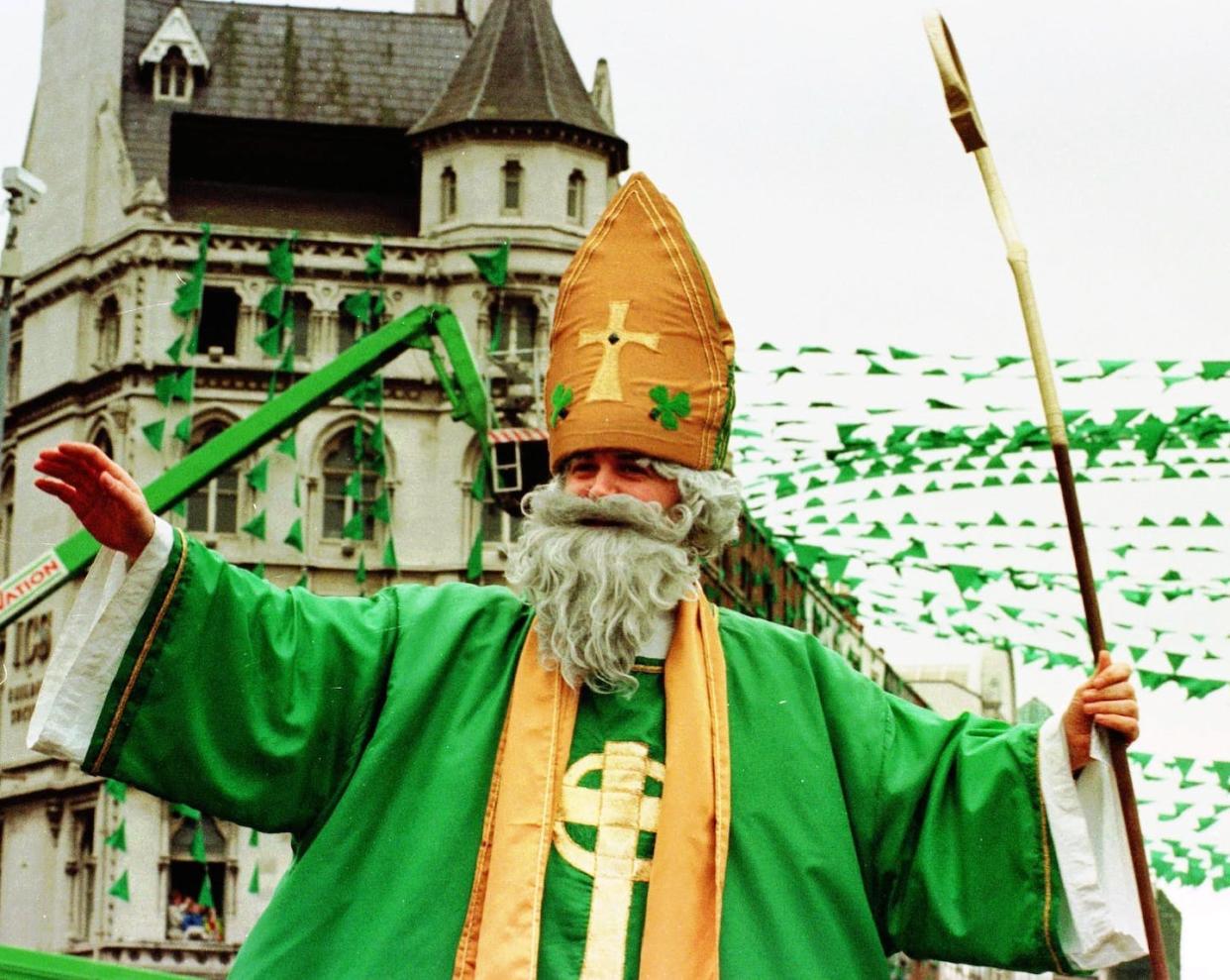 A man dressed as Saint Patrick blesses the crowd in Dublin as the parade makes its way through the Irish capital in 1998. <a href="http://www.apimages.com/metadata/Index/Associated-Press-International-News-Ireland-IRE-/f537e4ff43e5da11af9f0014c2589dfb/40/0" rel="nofollow noopener" target="_blank" data-ylk="slk:AP Photo/John Cogill;elm:context_link;itc:0;sec:content-canvas" class="link ">AP Photo/John Cogill</a>