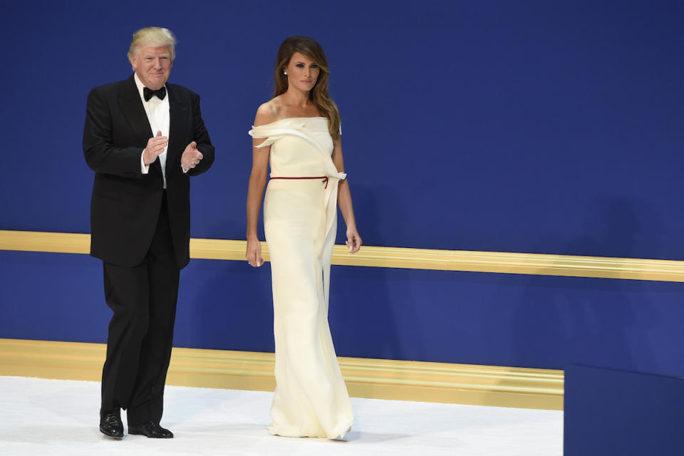 <p>For the inaugural balls, the newly-minted first lady wore a white off-the-shoulder gown that she helped design with Hervé Pierre. According to Pierre himself, the FLOTUS was very involved in the process. “Hervé, I love you, but I cannot move my arm to hold my husband’s arm when we dance,” Pierre said of the pair’s collaboration process, according to Bazaar.com. “As a man designing for a woman, you put into the clothing your ideals, what you idolize, but a woman will put you back on track and say, ‘I cannot reach my fork,’” he said. (Photo: Getty Images) </p>