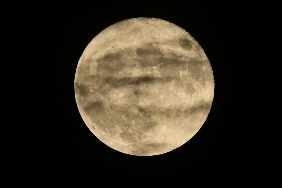 The Sturgeon super moon rises in Glendale, California on August 1, 2023. (Photo by Robyn Beck / AFP) (Photo by ROBYN BECK/AFP via Getty Images)