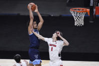 Villanova's Jeremiah Robinson-Earl, left, grabs an offensive rebound over Hartford's Hunter Marks during the first half of an NCAA college basketball game Tuesday, Dec. 1, 2020, in Uncasville, Conn. (AP Photo/Jessica Hill)