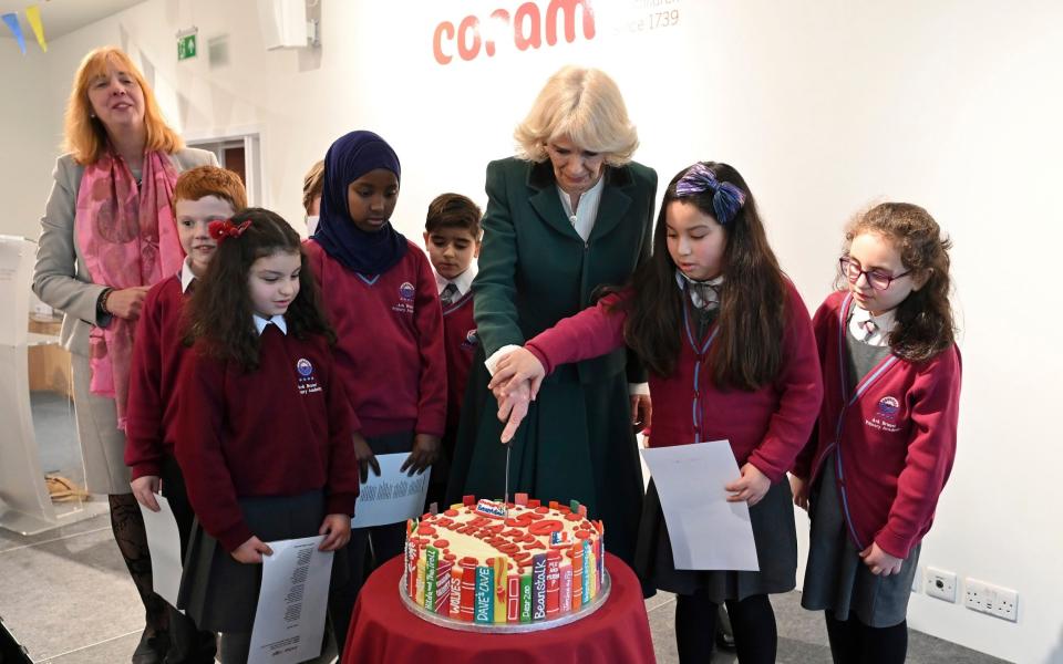 Camilla cuts a cake to celebrate Coram Beanstalk's 50th anniversary - Justin Tallis/AFP