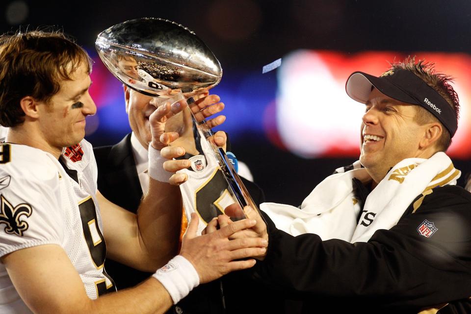 Drew Brees and head coach Sean Payton show off the spoils of victory after defeating the Colts – led by Peyton Manning – in Super Bowl XLIV in 2010. (Getty Images)