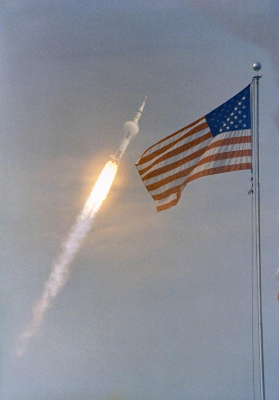 <p>A ring of condensation forms around the Saturn V rocket as it compresses the air around it during the launch of Apollo 11.</p>