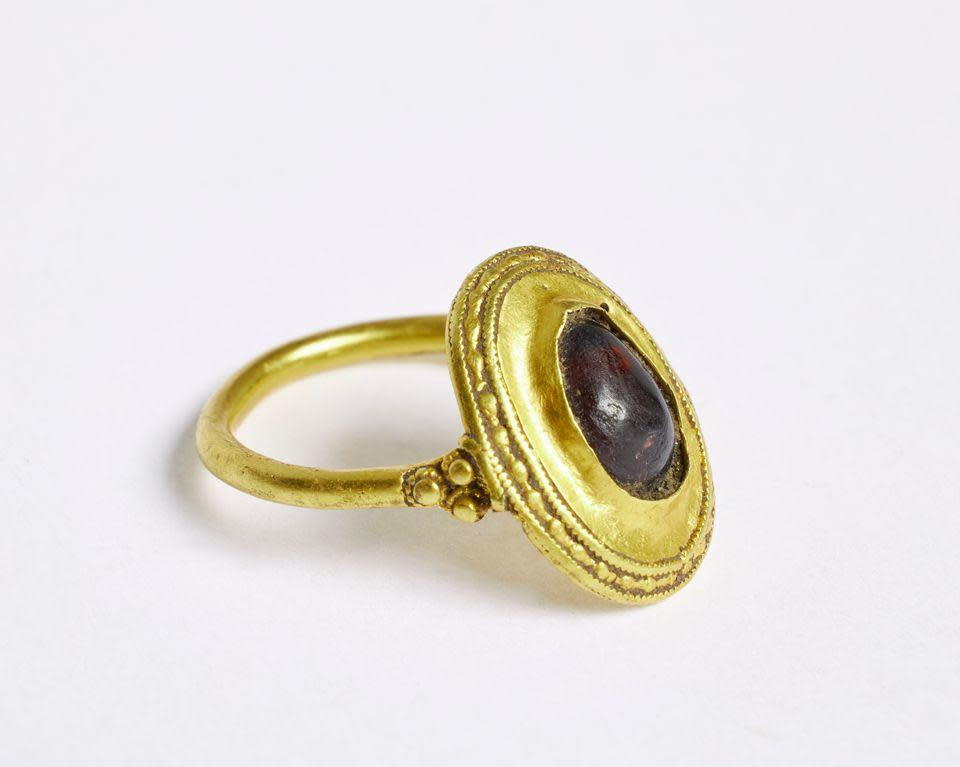 A gold ring set with a red semi-precious stone was recently found in southern Denmark. Officials say it likely dates back more than 1,400 years. / Credit: National Museum of Denmark