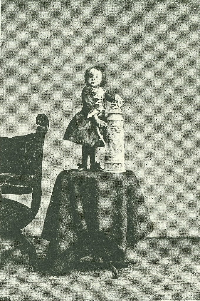A woman standing on a small table