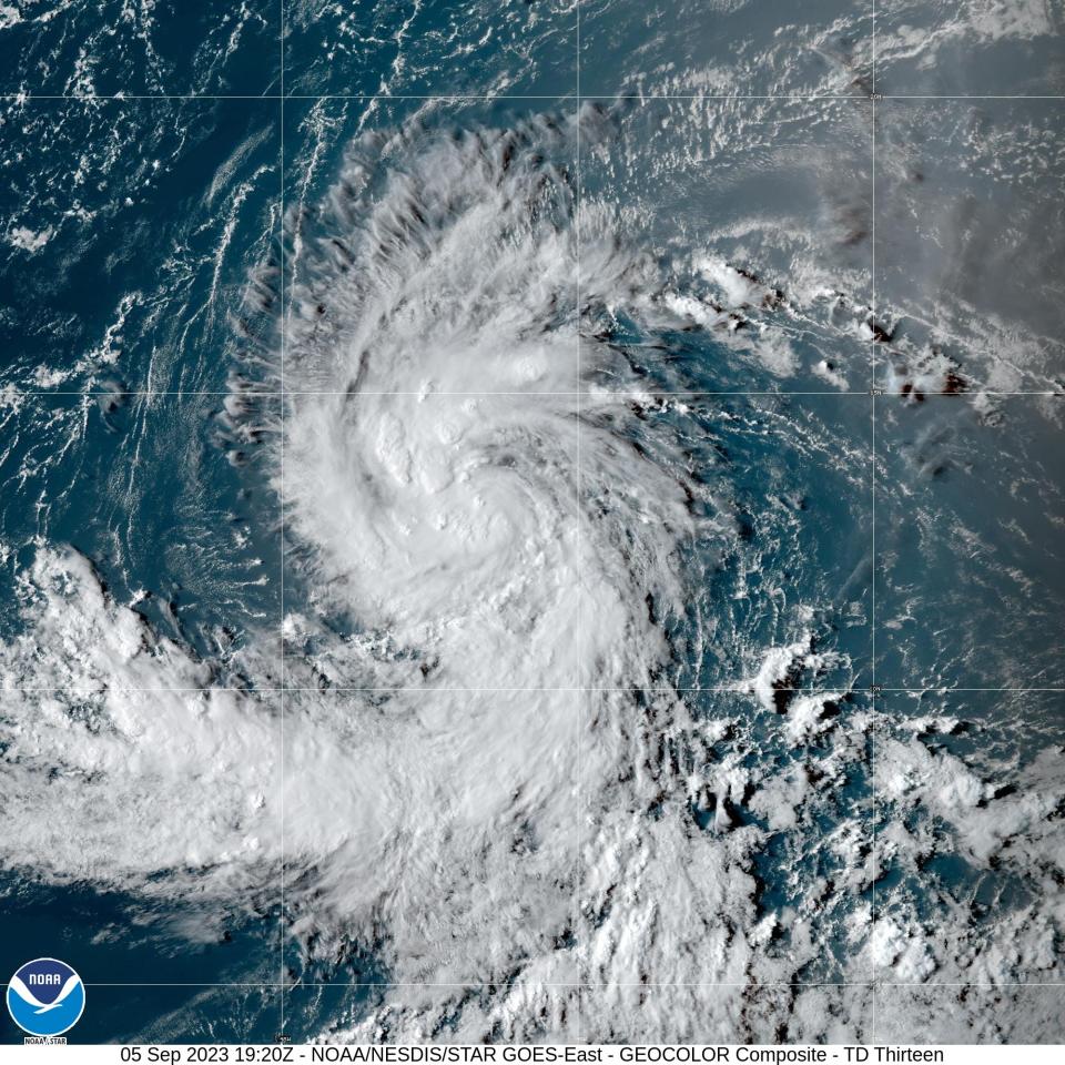 Tropical Depression 13, expected to become Tropical Storm Lee, is getting organized in the Atlantic Ocean between Africa and the Windward Islands, in this satellite image provided by the National Oceanic and Atmospheric Administration. .