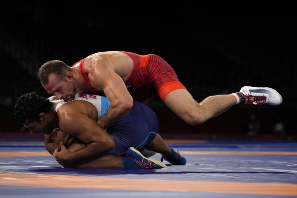 United States' David Morris Taylor III, top, and India's Deepak Punia compete in the men's 86kg Freestyle semifinal wrestling match at the 2020 Summer Olympics, Wednesday, Aug. 4, 2021, in Chiba, Japan. (AP Photo/Aaron Favila)