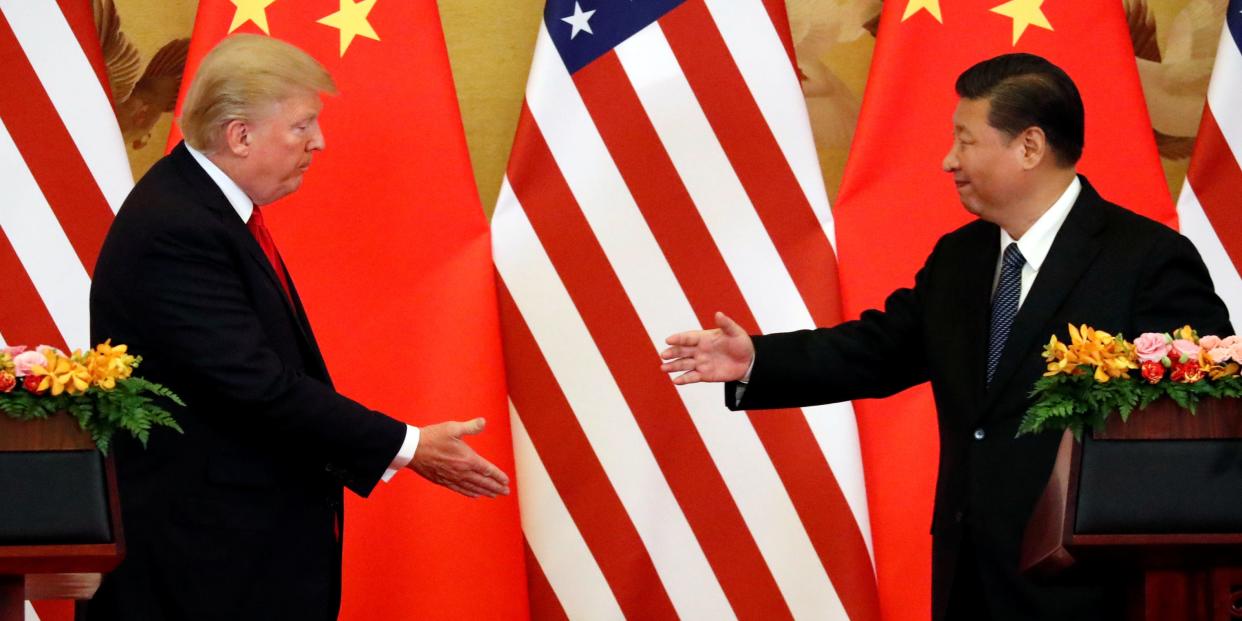 trump xi shake hands