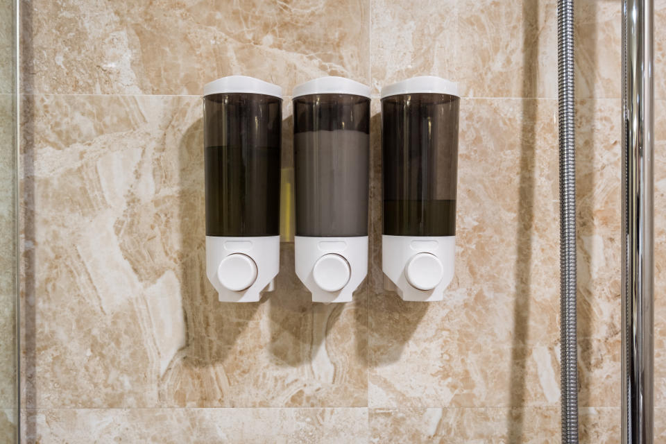 IHG hotels will switch to bulk-sized, refillable amenities by 2021. Some hotels have already moved to larger bottles and wall-mounted dispensers, like the ones pictured. (Photo: Mumemories via Getty Images)