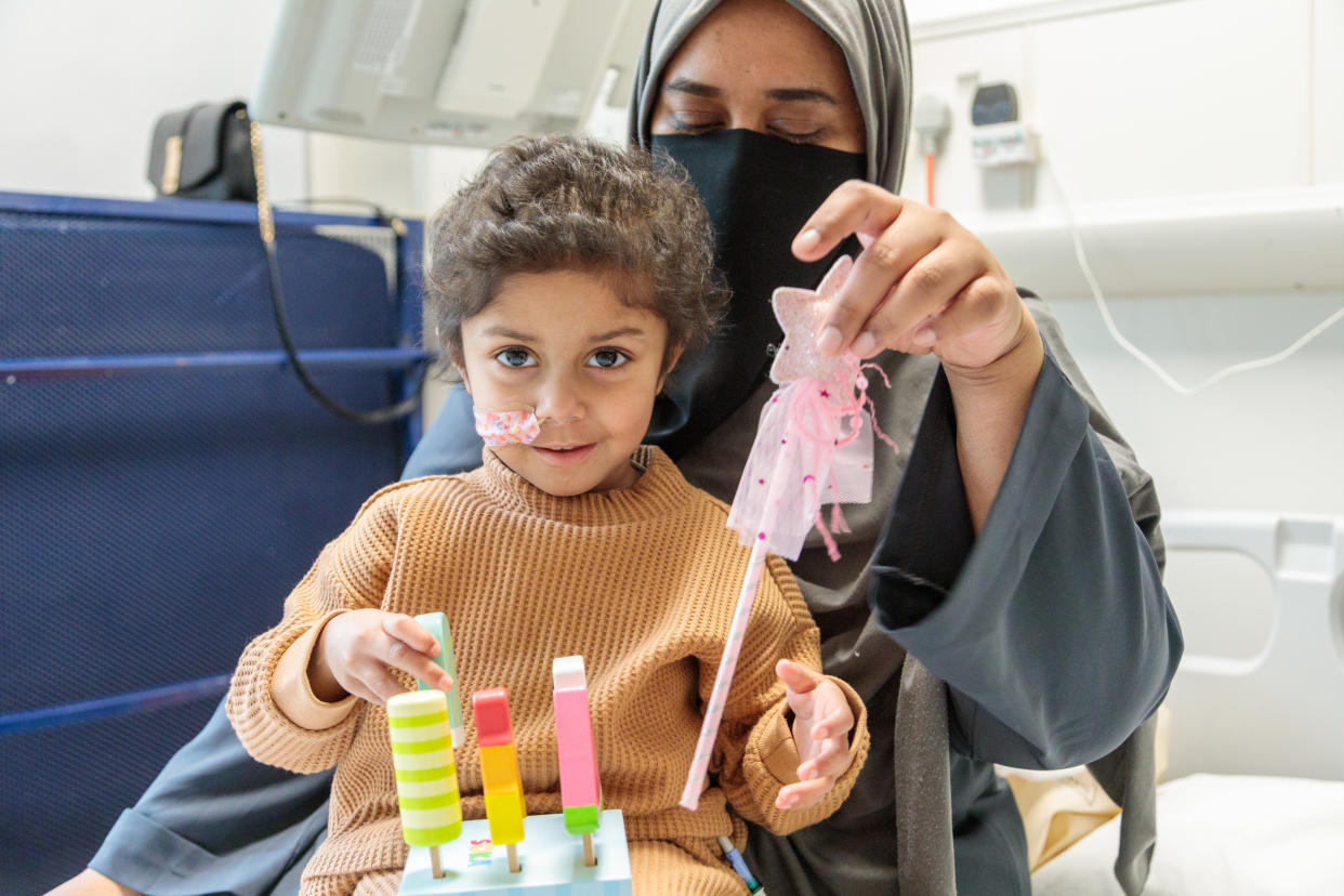 Yumna plays with her mother during treatment at Great Ormond Street Hospital in London (Gosh Charity/PA)