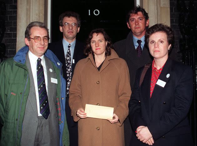 Rosemary Hunter, center, with other Snowdrop Campaign members outside 10 Downing Street with the petition calling for a total handgun ban in November 1996. (Photo: David Cheskin - PA Images via Getty Images)