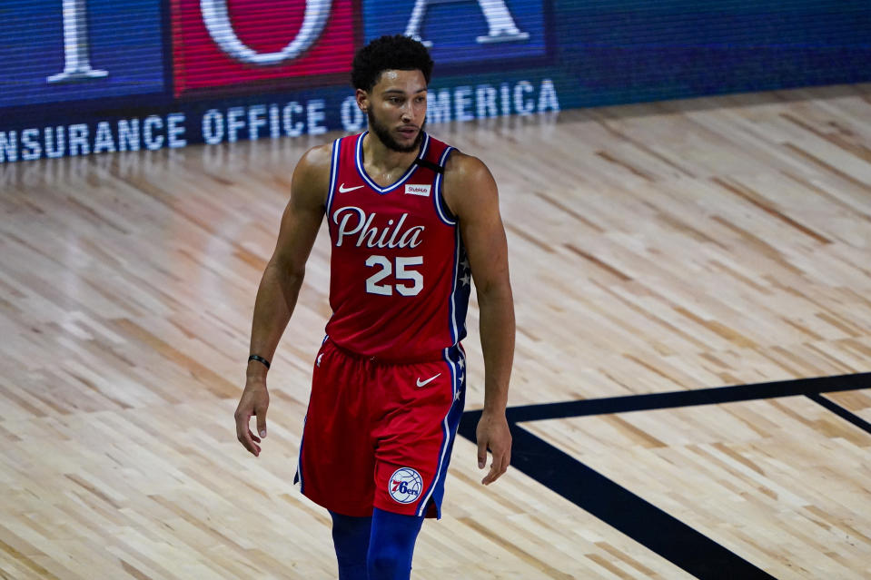 Philadelphia 76ers guard Ben Simmons (25) walks up the court during the first half of an NBA basketball game against the Washington Wizards Wednesday, Aug. 5, 2020 in Lake Buena Vista, Fla. (AP Photo/Ashley Landis)