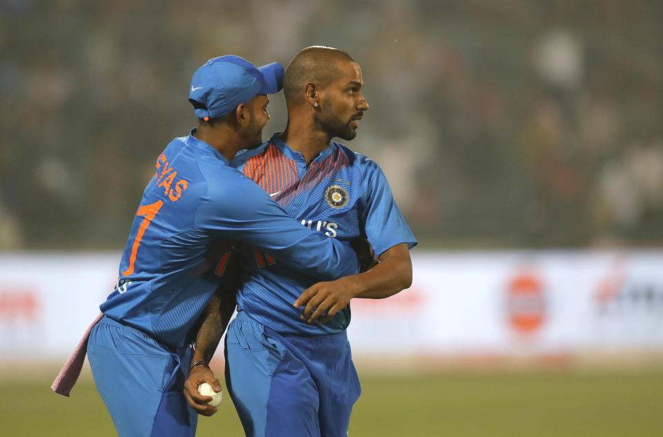 India's Shikhar Dhawan, right, celebrates the wicket of Bangladesh's Naim Sheikh with his team member during the first T20 cricket match at the Arun Jaitley stadium, in New Delhi, India, Sunday, Nov. 3, 2019. (AP Photo/Manish Swarup)