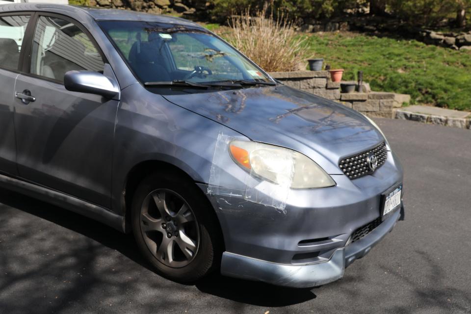 The damage to the headlight of Sandie Ortiz's car after it was struck by a Yonkers police SUV in June, is pictured at her home in Ossining March 29, 2024. Ortiz has been trying to get the police insurance to cover the $3,000 in damages to her car.