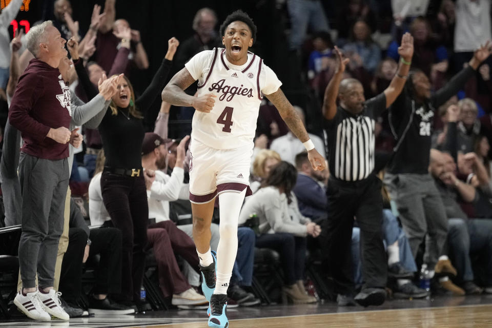 Texas A&M guard Wade Taylor IV (4) reacts after making a 3-point basket against Kentucky late in the second half of an NCAA college basketball game Saturday, Jan. 13, 2024, in College Station, Texas. (AP Photo/Sam Craft)