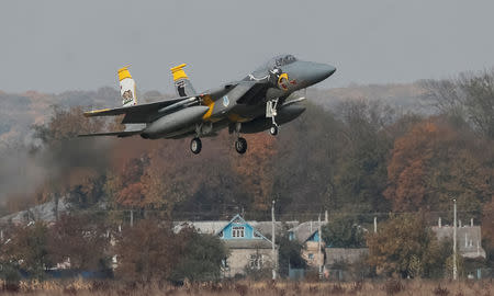 FILE PHOTO: A U.S. Air Force F-15 fighter jet lands during drills in Ukraine, October 12, 2018. REUTERS/Gleb Garanich/File Photo