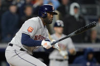 Houston Astros Yordan Alvarez follows through on an RBI base hit to score the tying run against the New York Yankees during the seventh inning of Game 4 of an American League Championship baseball series, Sunday, Oct. 23, 2022, in New York. (AP Photo/John Minchillo)