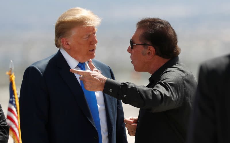 FILE PHOTO: Trump speaks with Steve Wynn in Las Vegas