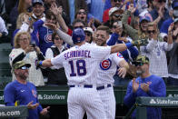 Chicago Cubs' Frank Schwindel (18) celebrates with Patrick Wisdom after hitting a solo home run during the eighth inning of a baseball game against the Arizona Diamondbacks in Chicago, Sunday, May 22, 2022. The Cubs won 5-4. (AP Photo/Nam Y. Huh)