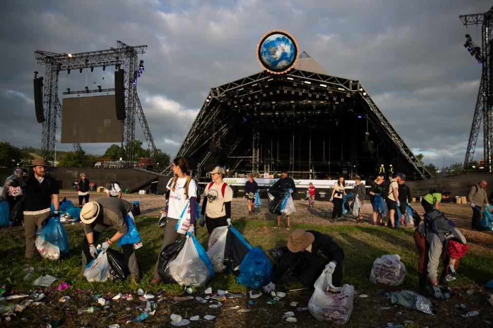 Clean up begins in front of the pyramid stage at the Glastonbury Festival at Worthy Farm in Somerset (Aaron Chown/PA) (PA Archive)