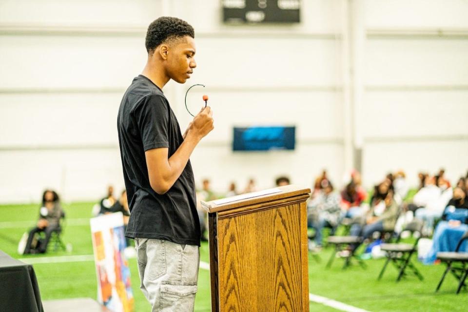 Aa’Khai Hollis speaks at the first Delaware Black Student Summit at the Chase Fieldhouse in April 2022, bringing together Black Student Unions from across Delaware school districts.