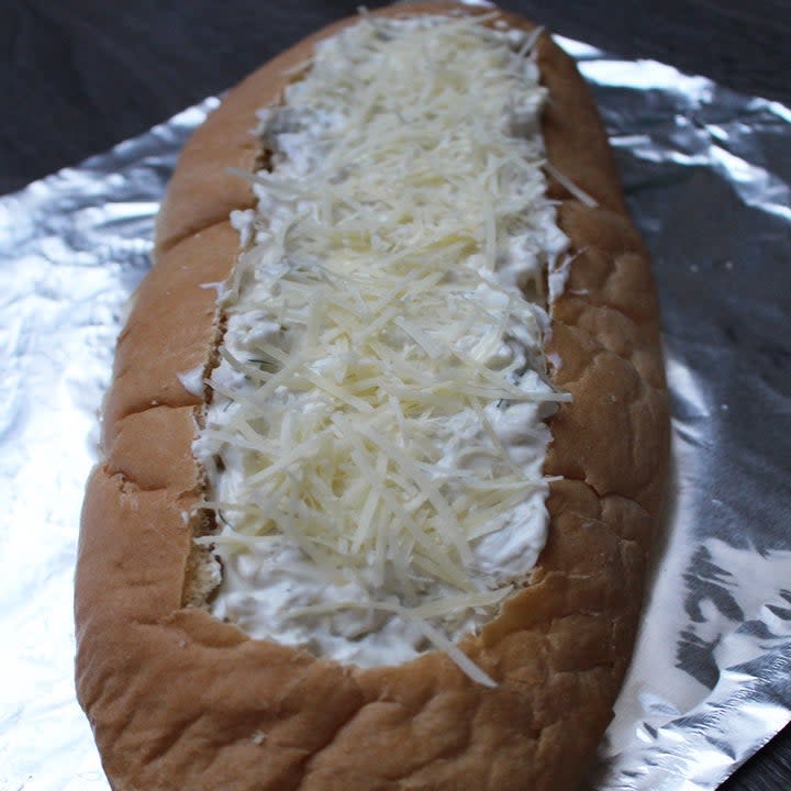 A cheese-stuffed, scooped-out baguette