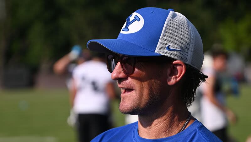 BYU offensive coordinator Aaron Roderick talks with defensive coordinator Jay Hill after BYU held their first fall football practice in Provo on Wednesday, July 31, 2024.