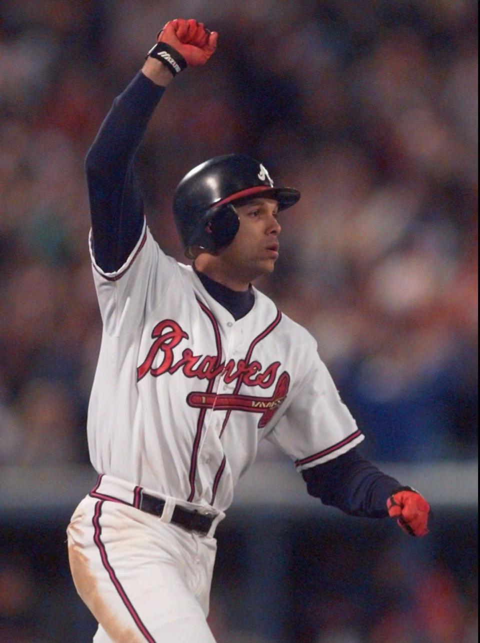 Atlanta's David Justice reacts after his sixth-inning home run in Game 6 of the World Series vs. Cleveland, Saturday, Oct. 28, 1995, in Atlanta. Atlanta won 1-0 to win the series.